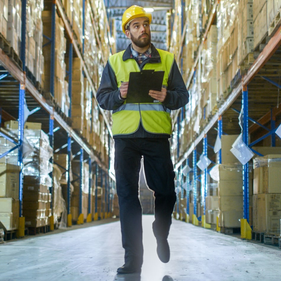 Supply chain professional taking inventory in a warehouse
