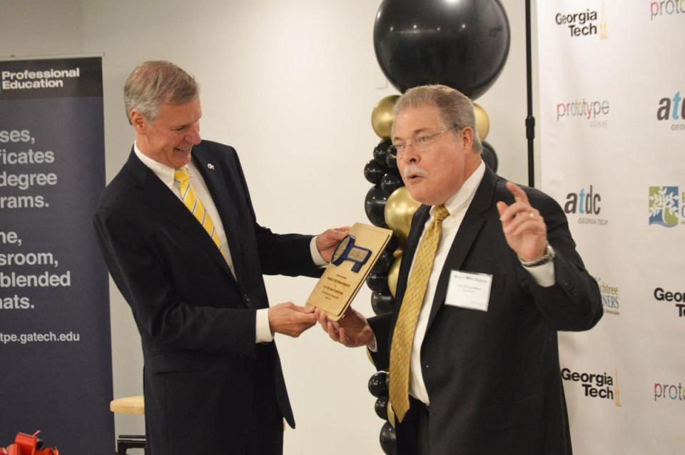 Georgia Tech president Bud Peterson presented key to Peachtree Corners by mayor Mike Mason