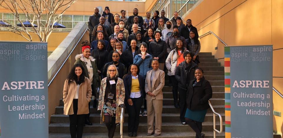 The third cohort of ASPIRE poses on the steps of the Global Learning Center