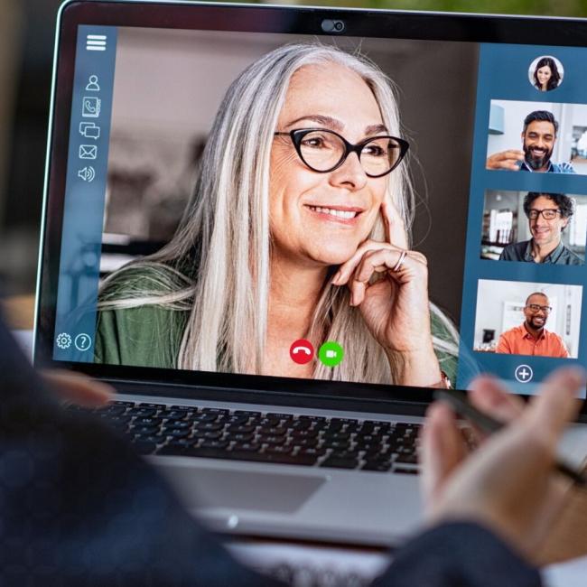 Inclusive leader running a virtual meeting with diverse team